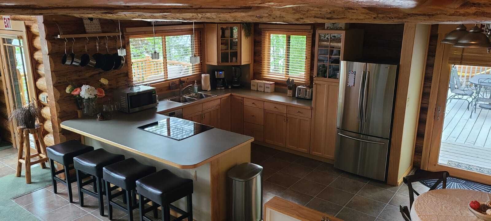 Waterfront w/ Water Slide, Rock Climbing Wall & Ice Fishing Shanty in Winter