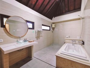 Bathtub, hair dryer, bidet, towels