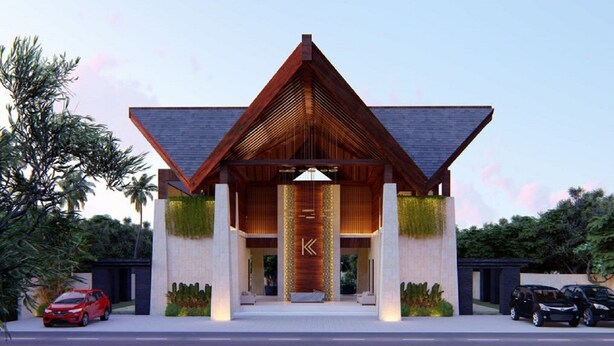 A modern building with a prominent 'K' logo, a triangular roof, and a landscaped entrance. - Villa 3 BR Central Seminyak mins to Beach (Seminyak)