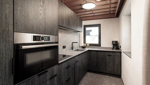 Chalet, 2 Bedrooms, Sauna, Mountain View (Lodge) | Private kitchen | Espresso maker, coffee/tea maker, full-sized fridge, microwave - FIVE SEASONS | Hideaway Saalbach (Saalbach-Hinterglemm)