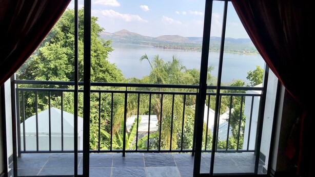 Suite, 1 King Bed | Living area | 40-inch LCD TV with satellite channels, TV - Kosmos Lodge (Hartbeespoort)