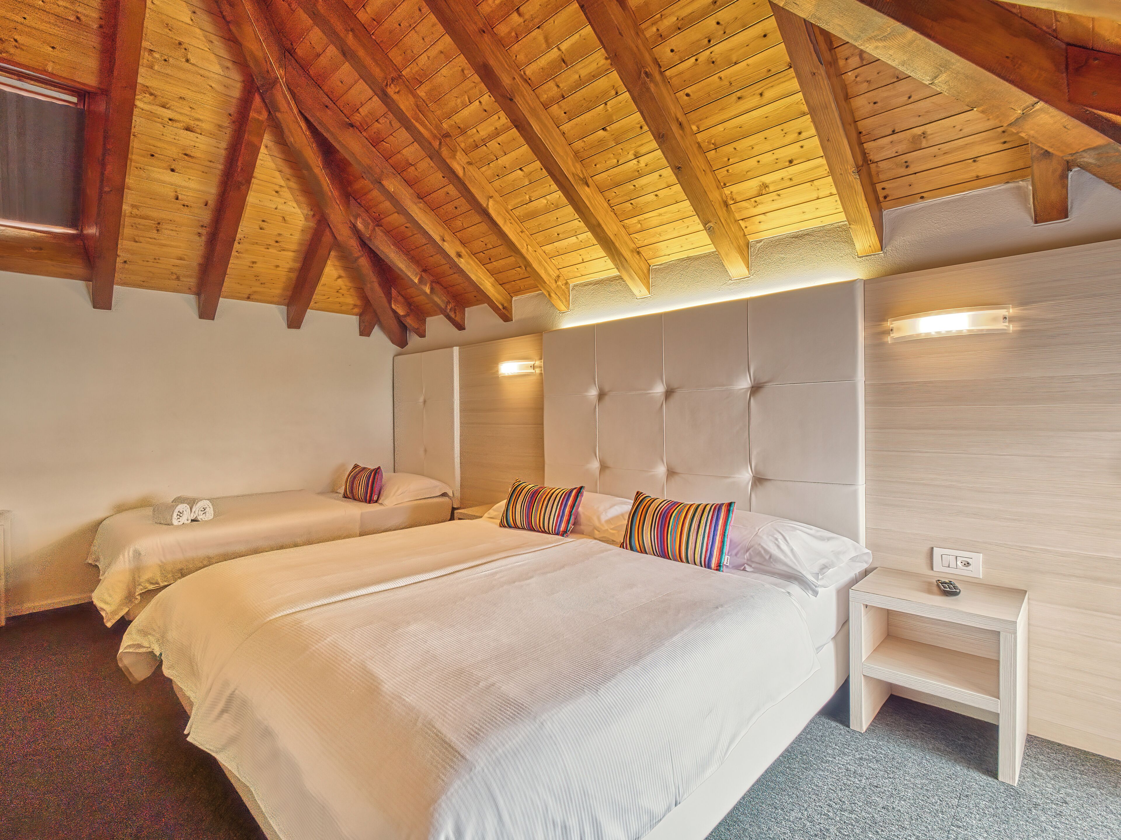 family room, balcony, lake view | down duvets, in-room safe, individually decorated