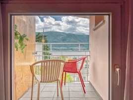 Panoramic Double Room, Balcony, Lake View | Down comforters, in-room safe, individually decorated