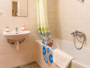 A bathroom with a sink, faucet, and shower head. - Apartments Beba - Peaceful Location (Trogir)