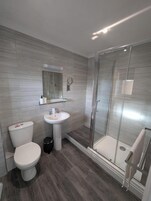 Family Suite, Balcony, Sea View | Desk, laptop workspace, blackout drapes, iron/ironing board