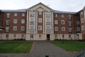 Stunning multi-story building with a central entrance and balconies.