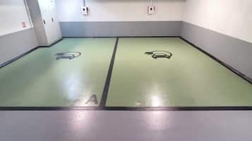A parking garage with two marked parking spaces labeled A and B.