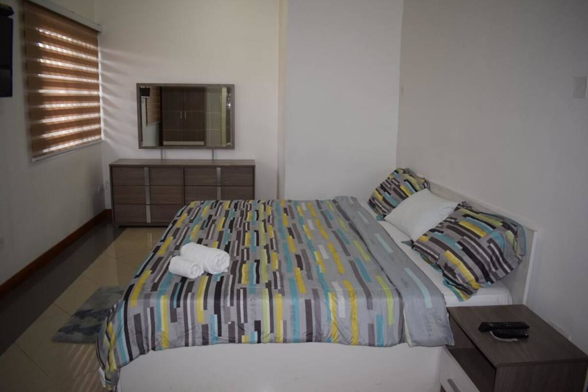 Apartment, 1 Bedroom, Ground Floor | Down comforters, blackout drapes, rollaway beds (surcharge), WiFi (free)