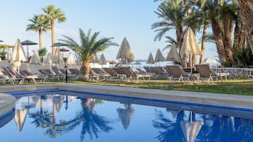 Outdoor pool, open 10:00 AM to 6:00 PM, pool umbrellas, sun loungers