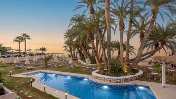 Outdoor pool, open 10:00 AM to 6:00 PM, pool umbrellas, pool loungers