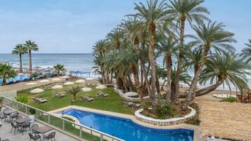 Outdoor pool, open 10:00 AM to 6:00 PM, pool umbrellas, pool loungers