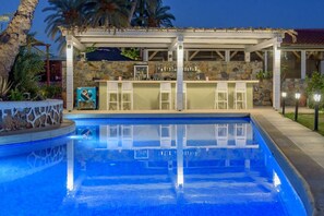 Outdoor pool, open 10:00 AM to 6:00 PM, pool umbrellas, pool loungers