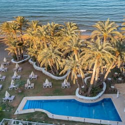 Outdoor pool, open 10:00 AM to 6:00 PM, pool umbrellas, pool loungers