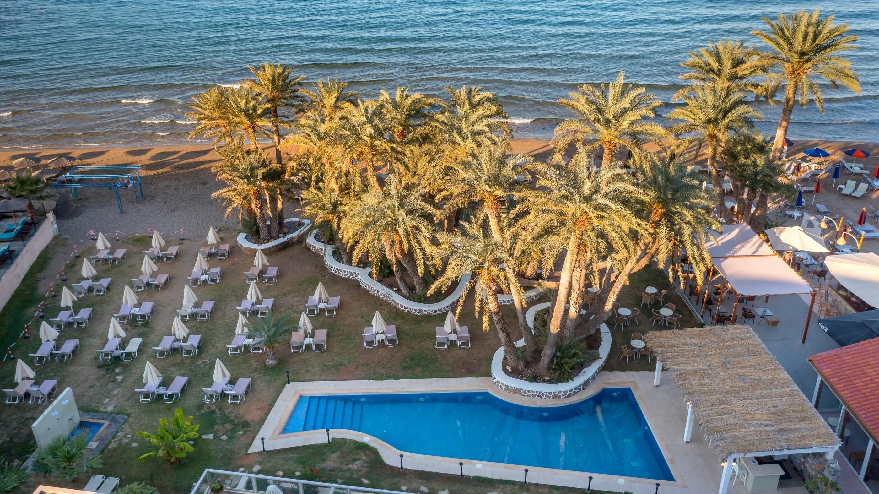 Outdoor pool, open 10:00 AM to 6:00 PM, pool umbrellas, pool loungers