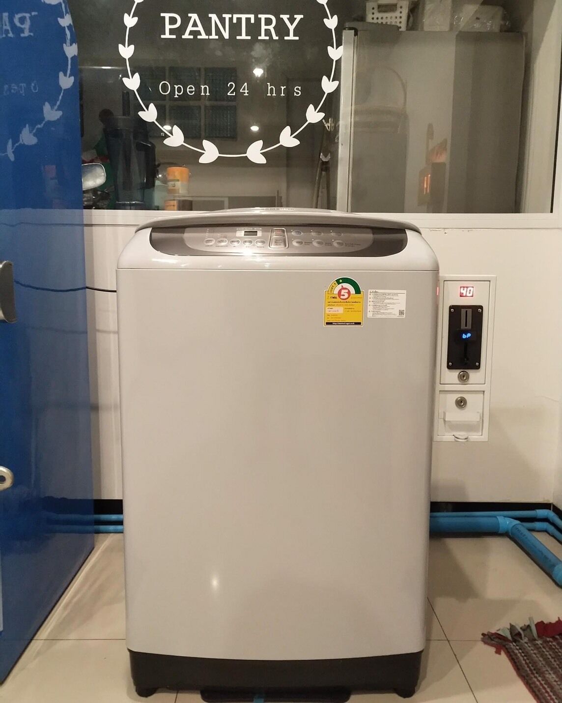 A white refrigerator with a digital display and a sticker indicating it is ENERGY STAR rated.