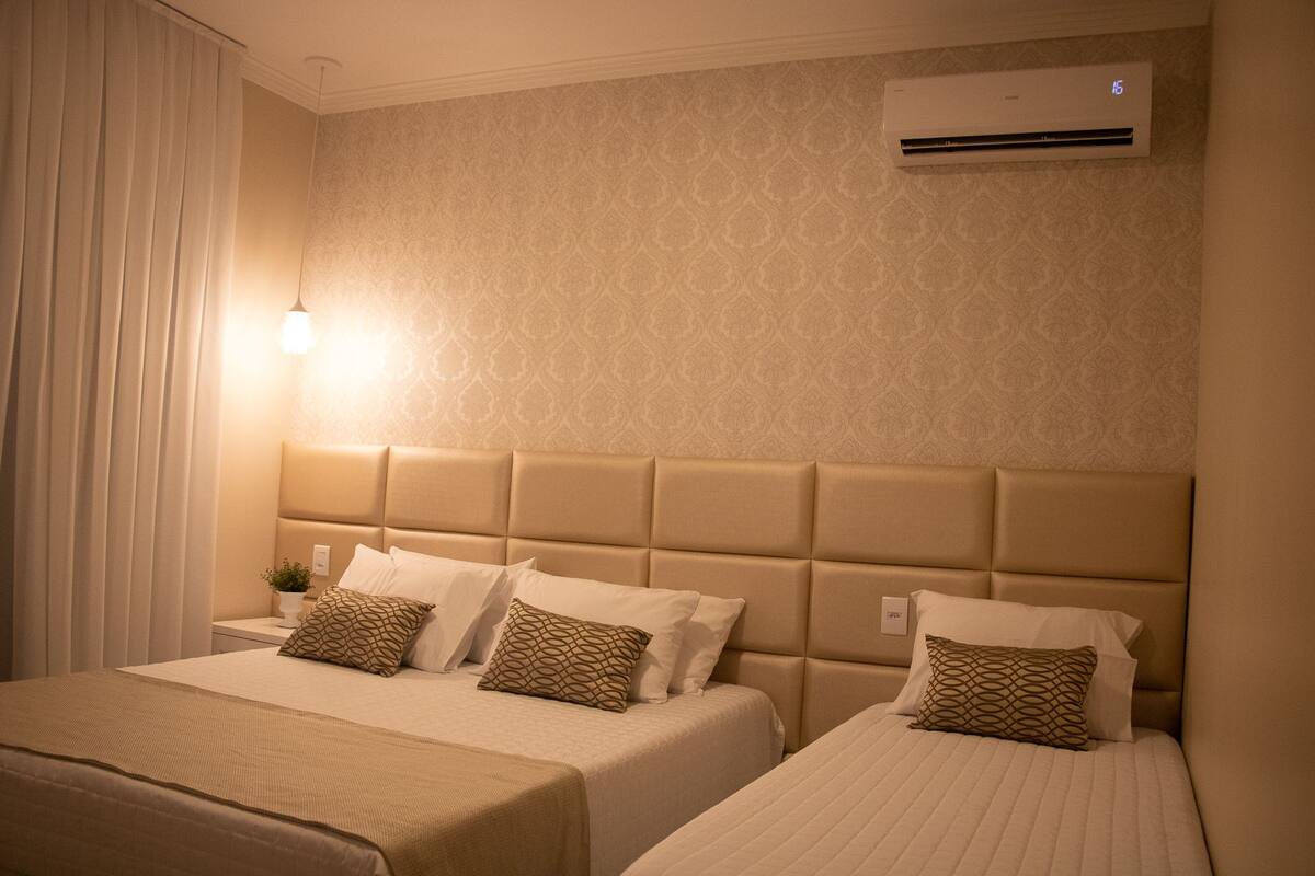 Triple Room, Multiple Beds, Non Smoking | Minibar, blackout drapes, iron/ironing board (on request), WiFi (free)