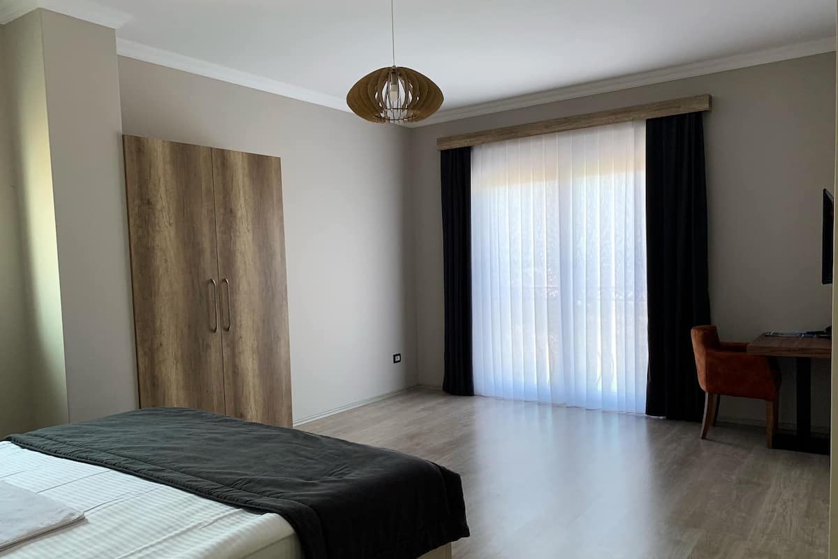 Family Double Room, Multiple Beds, Accessible, Garden View | Minibar, in-room safe, individually decorated, individually furnished