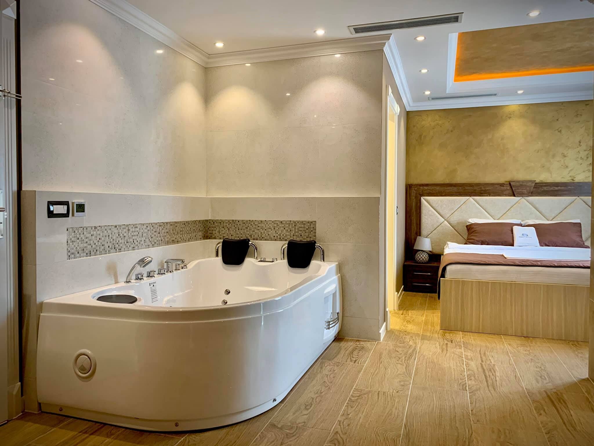 Exclusive Suite, 1 King Bed, Accessible, Garden View | Living area | Flat-screen TV