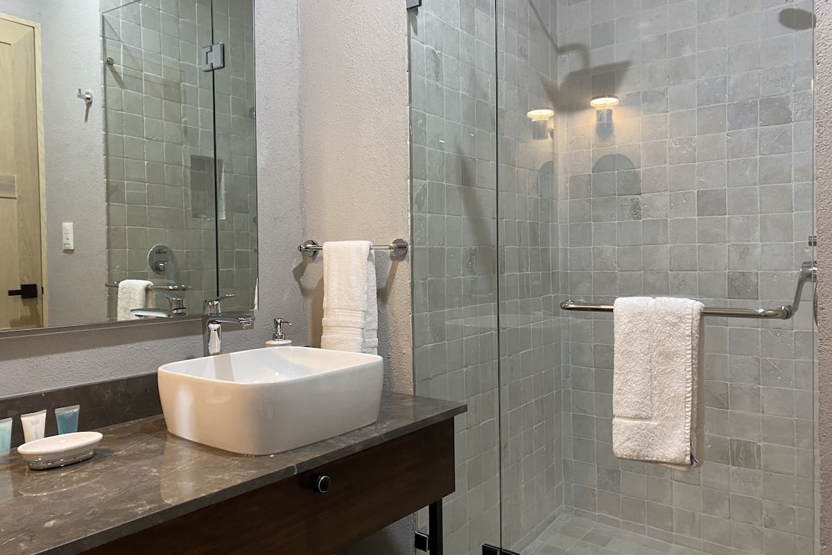 luxury room, 1 king bed | bathroom | free toiletries, hair dryer, bathrobes, towels