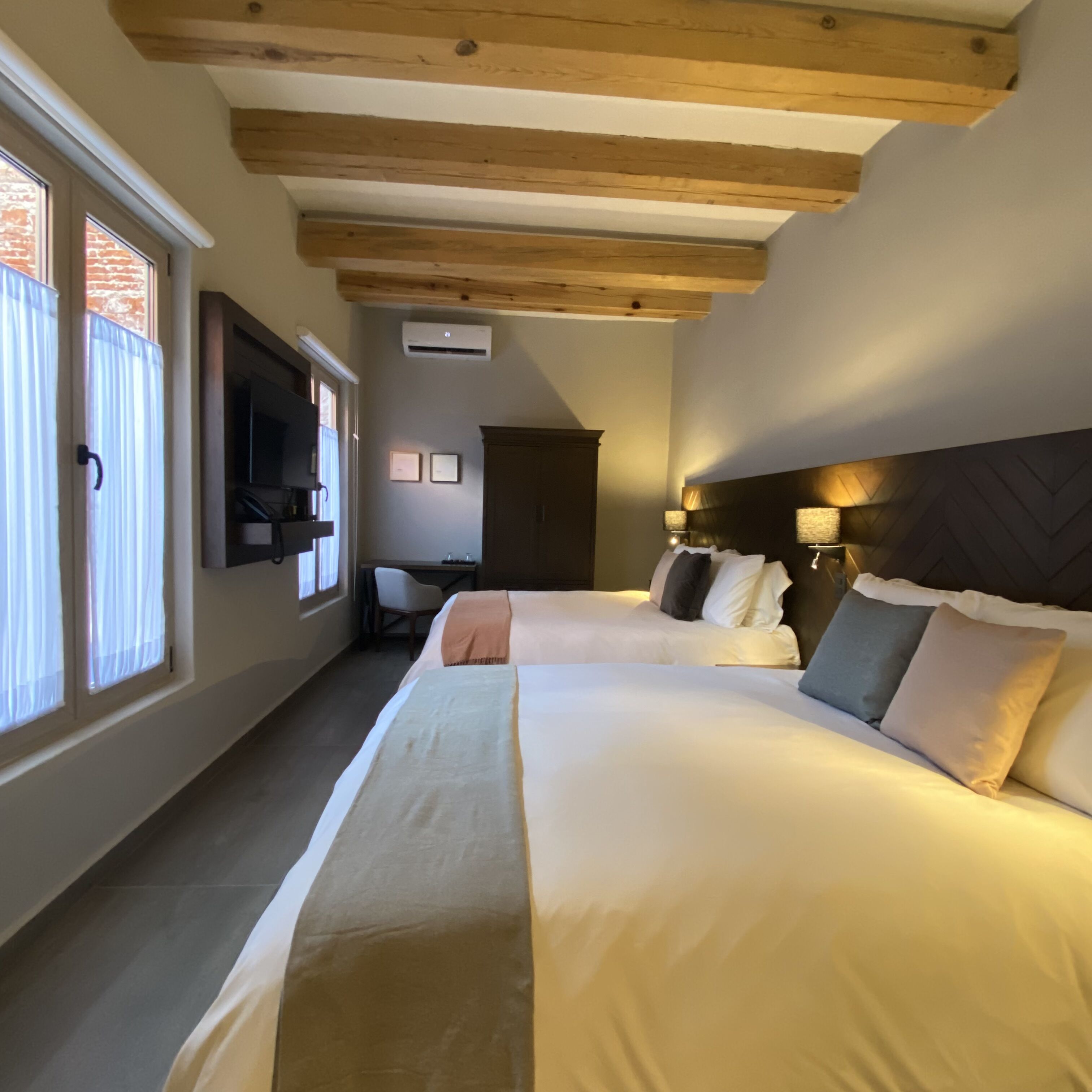 deluxe double room, 2 queen beds, non smoking, courtyard view | 1 bedroom, premium bedding, down duvets, in-room safe