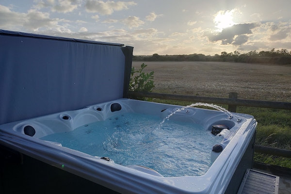 Hot tub with fountain and waterfall features.