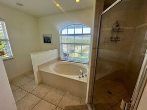 Bathtub, hair dryer, towels - Savor the Southern Exposure from this Trendy Island Home (Marco Island)