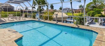 3BR waterfront home in Marco Island with heated pool, WiFi, and parking.