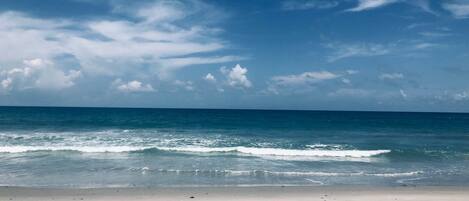 On the beach, sun-loungers, beach towels