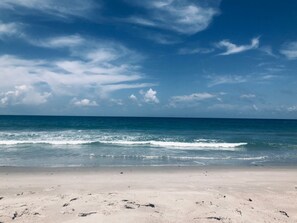On the beach, sun loungers, beach towels