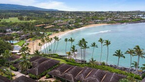 A coastal resort with beachfront villas, a sandy beach, and a view of the ocean. - Napili Lani 315  2BD Beachfront Luxury (Lahaina)