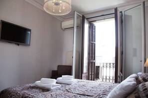 1 bedroom, desk, iron/ironing board, travel crib