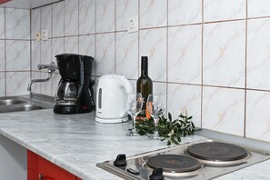 Fridge, microwave, stovetop, coffee/tea maker