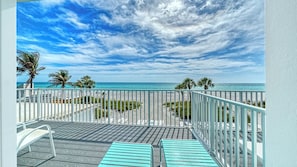 A balcony with a view of the beach and ocean, metal railings, and a patterned floor. - LaPlaya 205D! Spectacular views! (Longboat Key)