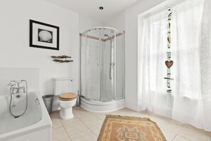 Bathtub, hair dryer, towels, soap