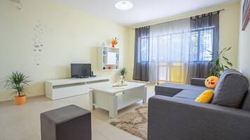 Superior Apartment, 1 Bedroom, Sea View | Living room | Flat-screen TV