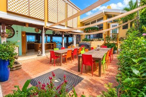 Outdoor dining - Private cliffside retreat full of magic. 9 bedrooms, 21 beds - infinity pool. (St. Thomas)