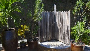 A wooden deck with potted plants and a wooden fence. - Upper Level apartment overlooking Marigot Bay (Marigot bay)