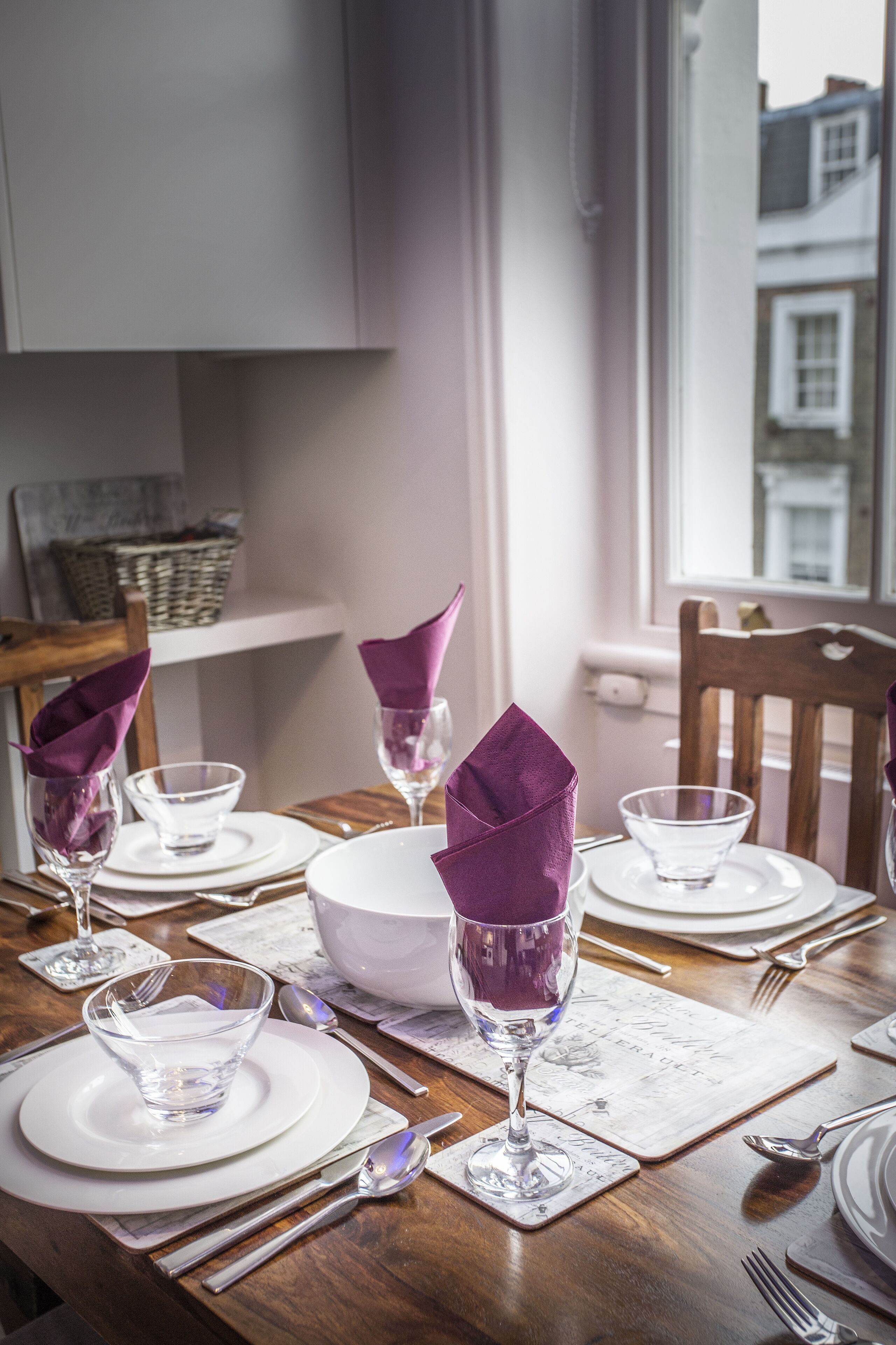 Bone china place settings and good cutlery and glassware