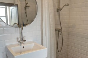 Combined shower/tub, hair dryer, towels, soap