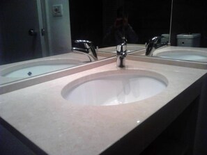 Shower, hair dryer, towels, toilet paper