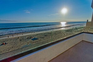 Enjoy breathtaking views of the ocean from this room's expansive balcony.