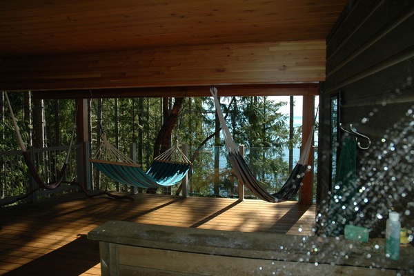 Outdoor shower on lower deck with ocean view.