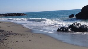 A beach with waves, rocks, and a clear sky. - House PANORAMIC VIEW SEA between SEA and MOUNTAIN  (Nocera terinese)