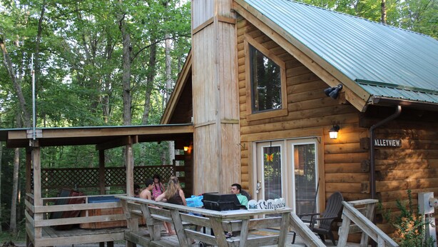 A wooden cabin with a porch, a covered deck, and a sign reading "Alleysview". - Valley View Cabin with show-stopping vaulted ceilings!  (Hico)