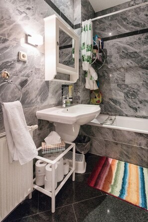 Combined shower/tub, hair dryer, towels, soap