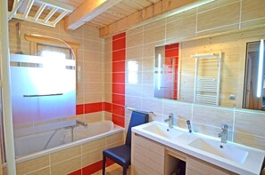 Bathtub, hair dryer, towels, soap