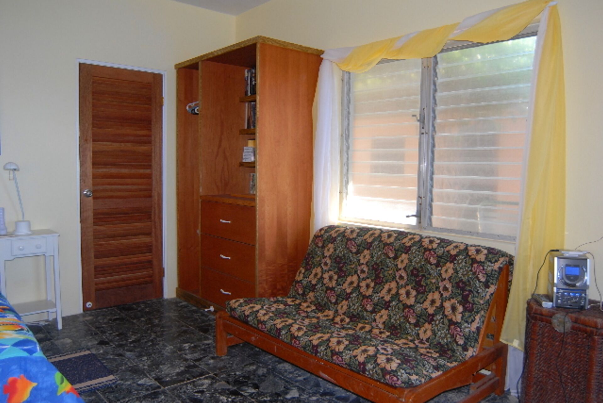 Front (Yellow) Bedroom showing Futon that can serve as an additional double bed