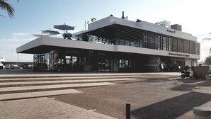 A modern building with a flat roof and large windows, labeled "Restaurant Brasserie Le Lampano." - Flat with balcony and sea view, very central.  (Saint-Raphaël)
