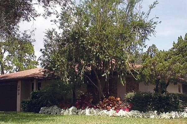 Front of home with caladiums in bloom