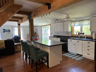 Charming lakeside cottage steps away from private sandy beach. Summer weeks open